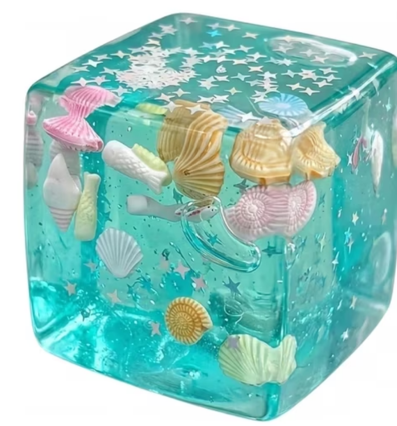 SMALL SQUISHY CUBE WITH SHELLS AND SPARKLES